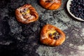 Top view of golden chese danish pasties with blackberries and powder sugar Royalty Free Stock Photo