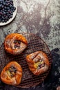 Top view of golden chese danish pasties with blackberries and powder sugar Royalty Free Stock Photo