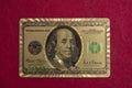 Top view of golden 100 dollar playing cards next to stacks of chips on red felt table Royalty Free Stock Photo