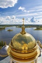 Top view of the golden domes of the Epiphany cathedral nilo-Stolobenskaya desert on the background of lake Seliger. Royalty Free Stock Photo