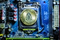 Top view of golden Eos cryptocurrency physical coin