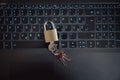 Top view of a golden padlock with keys in it placed on laptop computer keyboard Royalty Free Stock Photo
