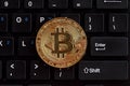 Top view of golden replica bitcoin on computer keyboard. Royalty Free Stock Photo