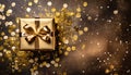 top view of a golden wrapped present with a beautiful bow on a rustic old table with lots of confetti