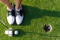 Top View golfer asian sporty woman focus putting golf ball on the green golf. Royalty Free Stock Photo