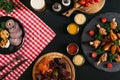 top view of gourmet assorted meat, vegetables, sauces and baked potatoes with roasted chicken Royalty Free Stock Photo