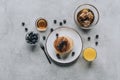 top view of gourmet pancakes with fresh berries juice and honey on grey Royalty Free Stock Photo