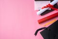 Graduation academic cap with diploma and mask isolated on pink table background Royalty Free Stock Photo