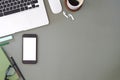 Top view of a graphic designer or photographer workspace with digital tablet, coffee cup, and notebook on white table. Blank Royalty Free Stock Photo