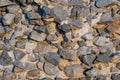 Top view of gravel crushed stones on the sand
