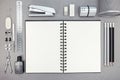 Top view of gray workplace with blank notebook and drawing tools Royalty Free Stock Photo