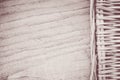 Top view grayscale of a woven basket on a wooden surface - space for text