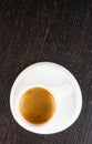 Top of view of great italian coffee in a white cup on black wood table