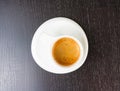 Top of view of great italian coffee in a white cup on black wood table