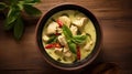 Top view of Green curry chicken on the wooden floor background. Thai food. Generative Ai Royalty Free Stock Photo