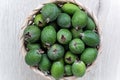 Top view green feijoa fruits in a basket.