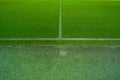 Top view of green football ground or soccer field with white stripes Royalty Free Stock Photo