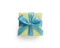 Top view of green gift box with blue ribbon bow isolated on white background Royalty Free Stock Photo