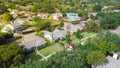 Top view green neighborhood near Dallas, Texas, USA surrounding by matured trees with a landscaping truck cut down tree