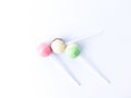 Top view of Green, Pink, and Brown lollipops. Three lollipops isolated on white. Royalty Free Stock Photo