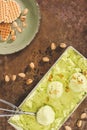 top view of green pistachio ice cream with scoop Royalty Free Stock Photo