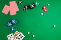 Top view of green poker game table with cards and chips