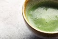 Top view of green tea matcha in a bowl on concrete surface. Close up shot Royalty Free Stock Photo