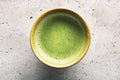 Top view of green tea matcha in a bowl on concrete surface. Single object Royalty Free Stock Photo