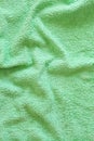 Top view of Green Towel texture. Green Towel Fabric Texture Background. Close-up. Green natural cotton towel background. Royalty Free Stock Photo