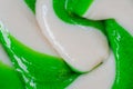 Top view: green and white large spiral candy lollipop - close up