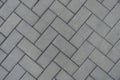 Top view of grey concrete pavement with herringbone layout Royalty Free Stock Photo
