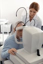 Top view of grey-haired man visiting professional ophthalmologist