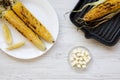 Top view, grilled corn cobs with lemon and butter Royalty Free Stock Photo