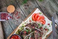 Top view grilled meat pork served on pita bread with onion, tomato and herbs, spices. Traditional eastern shashlik or kebab meat Royalty Free Stock Photo