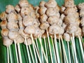 Top view of grilled pork balls skewers on fresh banana leaves Royalty Free Stock Photo