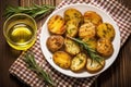 top view of grilled potatoes with rosemary on a wooden table