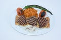 Top view of Grilled steak plate with roasted peppers, bulgur pilaf with tomatoes, roasted tomatoes