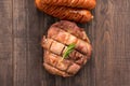 Top view grilled steak and sausage on a wooden background