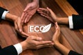 Top view group of business people forming circle hand on ECO icon. Quaint
