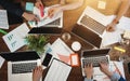 Top view of group business people sitting at table and using modern laptop, graphs and diagrams. Team of architecture are having a Royalty Free Stock Photo