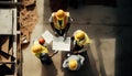 Top view of group of engineering team is meeting and planning construction work,Architects looking blueprint at Royalty Free Stock Photo