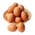 Top view of group of fresh brown chicken eggs in stack in wicker basket isolated on white background with clipping path