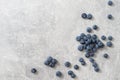 Top view of a group of fresh blueberries on gray background.