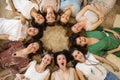 Top view group of happy female friends in bohemian hippie apparel lying circle together friendship