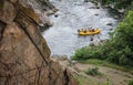 Top view. Group of people with guide whitewater rafting and rowing on river, extreme and fun