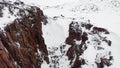 Top view of group of people in mountain pass in winter. Footage. Panorama of tourists traveling between mountain rocks Royalty Free Stock Photo