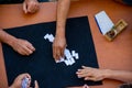 Top view of a group of people playing dominoes