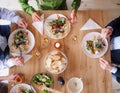 Top view of group of senior friends at dinner party at home, eating. Royalty Free Stock Photo