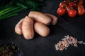 Top view on group of short sausages with dill and tomatoes Royalty Free Stock Photo