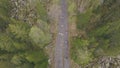 Top view of group of tourists walking along forest trail. Clip. Group of tourists goes to top of mountain along path Royalty Free Stock Photo